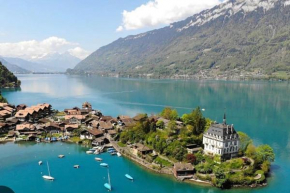 Romantic Swiss Alp Iseltwald with Lake & Mountains